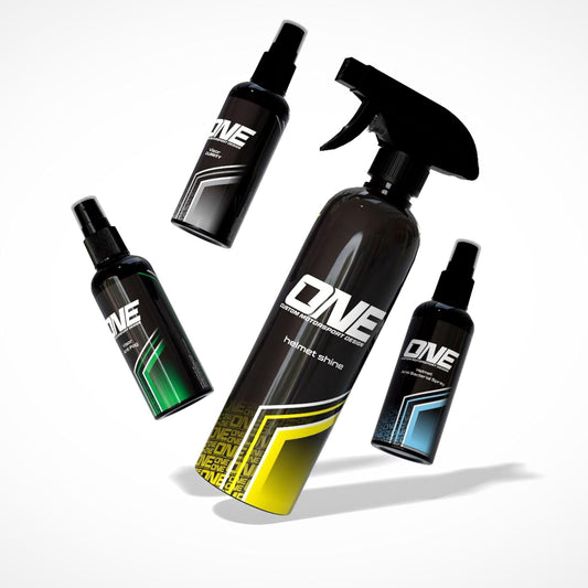 One Custom Design helmet care kit with cleaning spray, cloth, and accessories for helmet maintenance and protection.