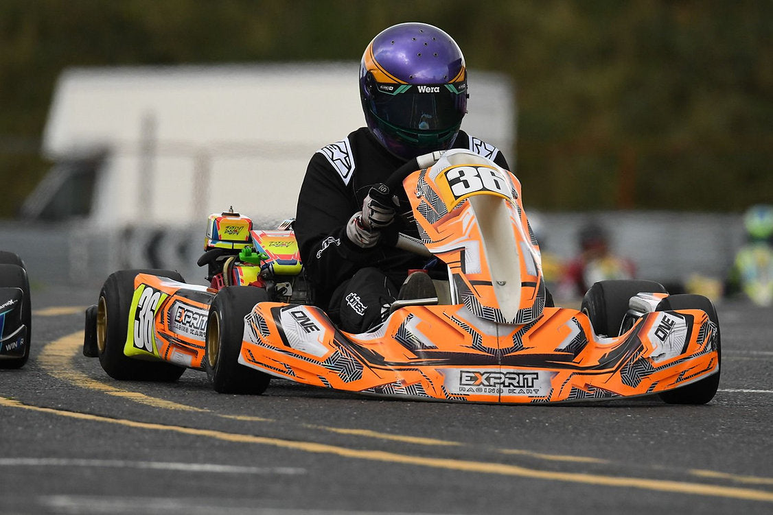 Custom kart design and print package by One Custom Design featuring vibrant, personalized graphics on a racing kart.